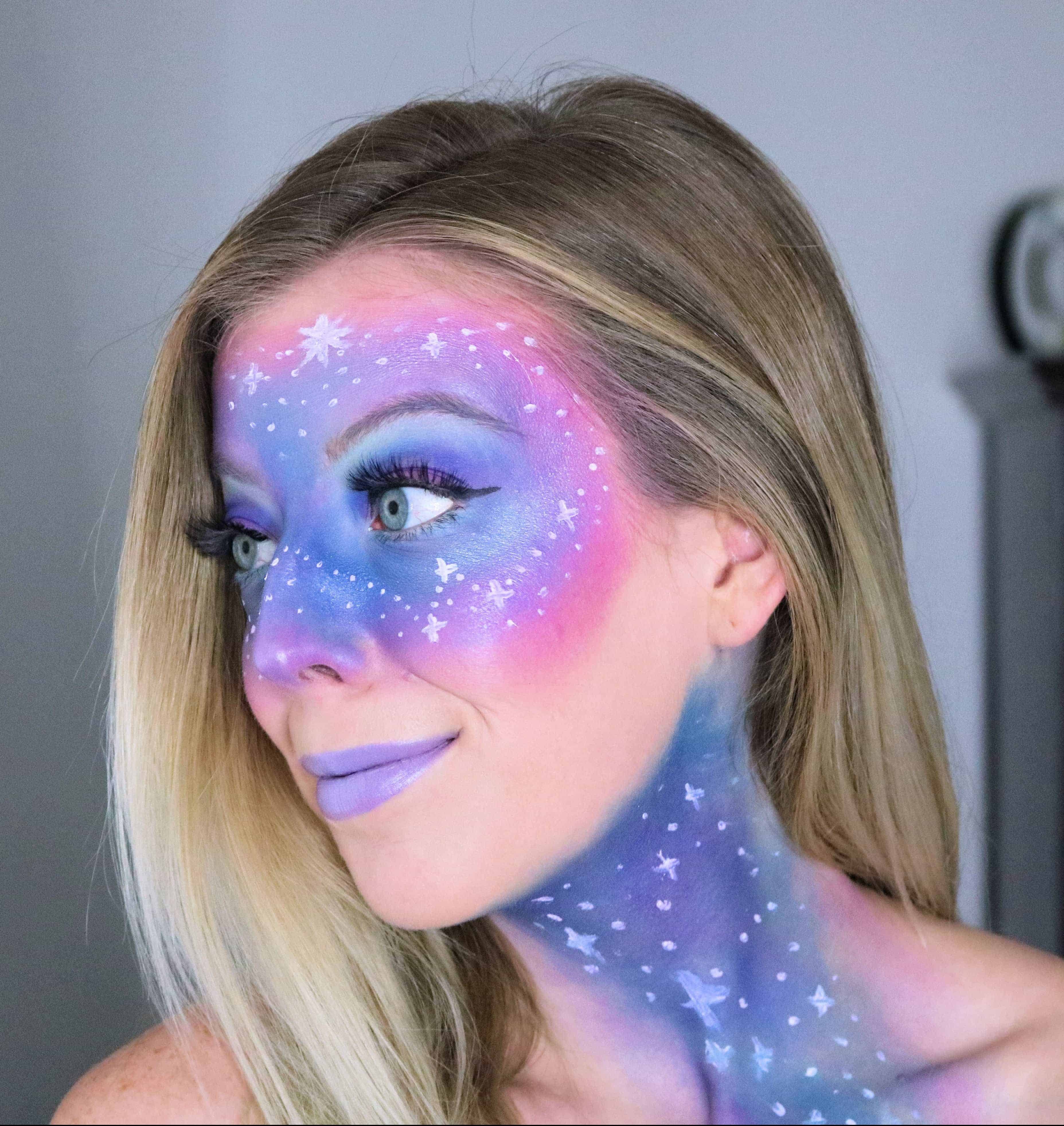 Ready to rock out your inner galaxy space princess for Halloween? Then check out my step-by-step, easy galaxy makeup tutorial with pink, purple, and blue colors and stars! This futuristic, alien, outer space look is so cute and the perfect fun Halloween costume! #galaxymakeup #halloweenmakeup #halloween #makeuptutorial