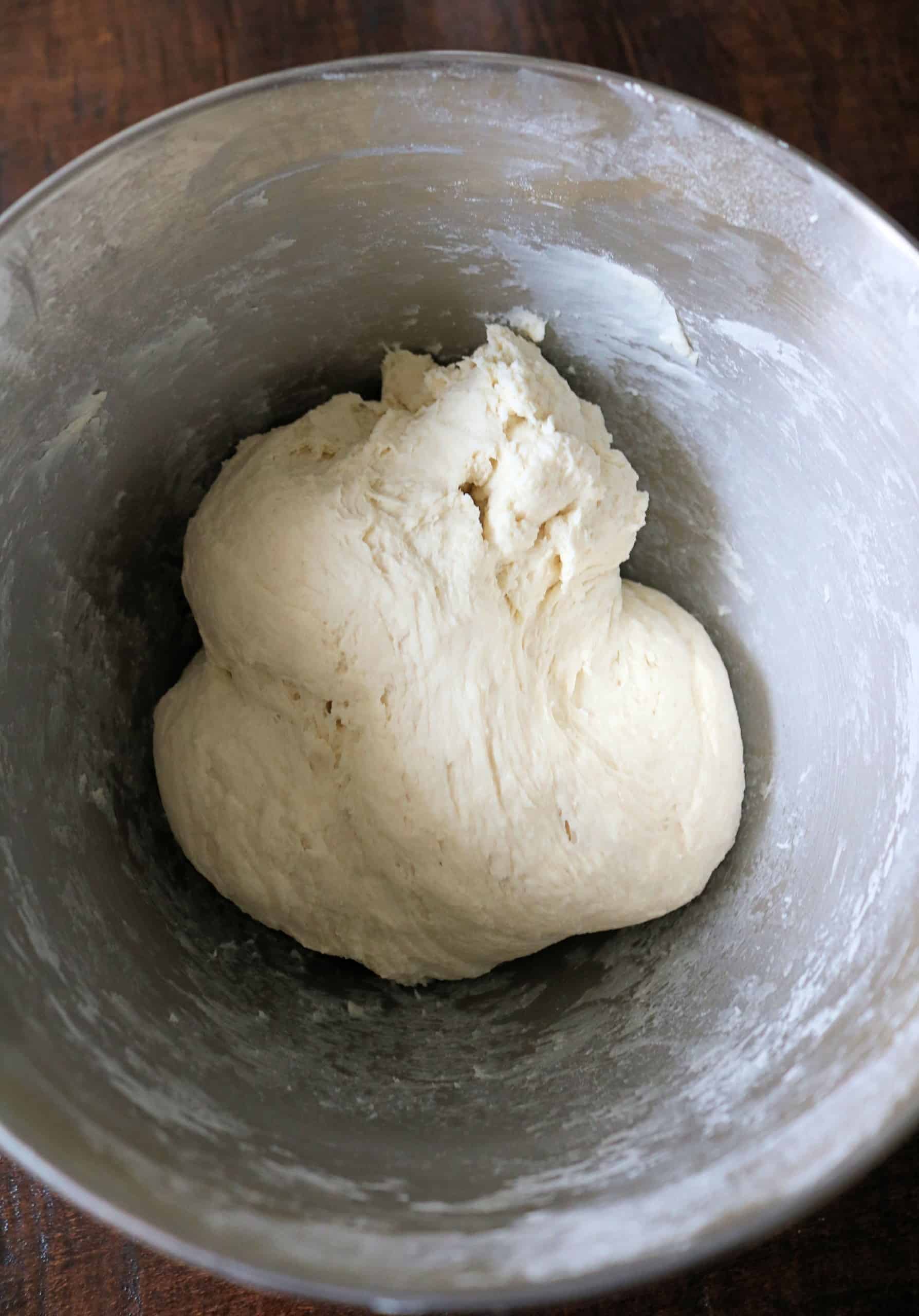 This Easy 2 Ingredient Pizza Dough with Self Rising Flour makes the most delicious pizza crust with no yeast or rising time required! Try my simple and healthy Weight Watchers Pizza Dough made with plain non-fat Greek yogurt and self-rising flour for your next homemade pizza night, and use it for pizza dough, cheese sticks, pretzel bites, and more! #pizzadough #pizza #weighwatchers #greekyogurtpizzadough #selfrisingdough