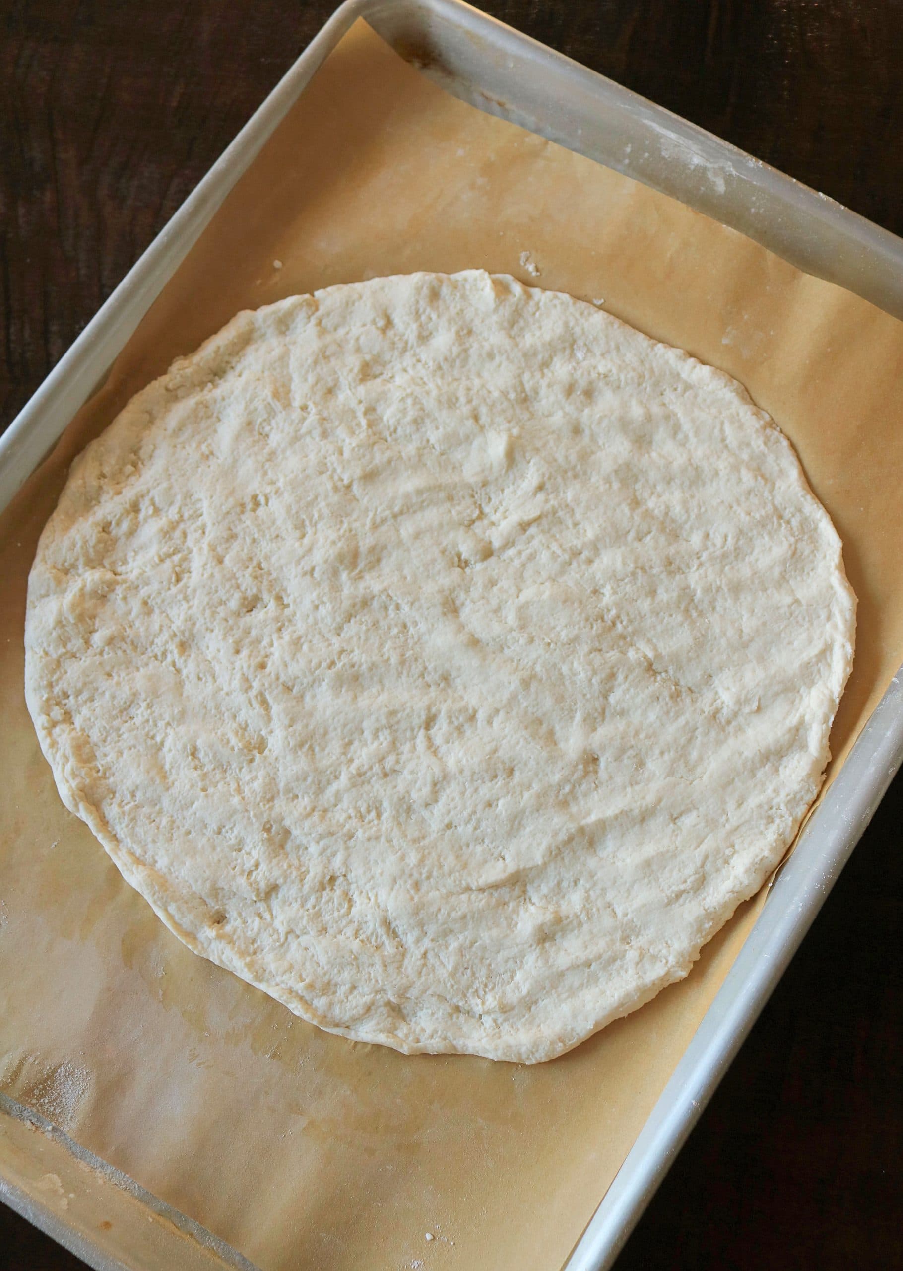 This Easy 2 Ingredient Pizza Dough with Self Rising Flour makes the most delicious pizza crust with no yeast or rising time required! Try my simple and healthy Weight Watchers Pizza Dough made with plain non-fat Greek yogurt and self-rising flour for your next homemade pizza night, and use it for pizza dough, cheese sticks, pretzel bites, and more! #pizzadough #pizza #weighwatchers #greekyogurtpizzadough #selfrisingdough