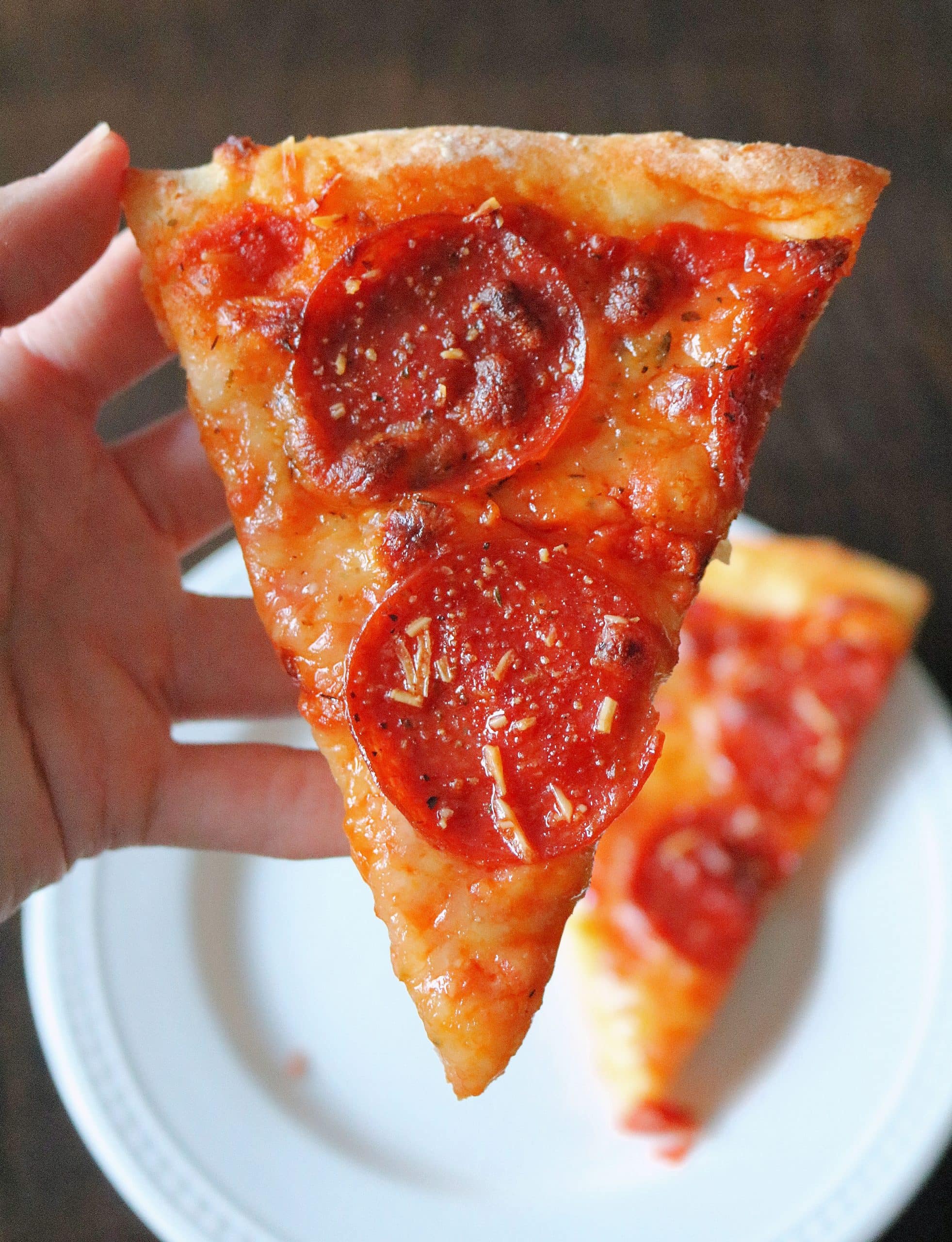 This Easy 2 Ingredient Pizza Dough with Self Rising Flour makes the most delicious pizza crust with no yeast or rising time required! Try my simple and healthy Weight Watchers Pizza Dough made with plain non-fat Greek yogurt and self-rising flour for your next homemade pizza night, and use it for pizza dough, cheese sticks, pretzel bites, and more! #pizzadough #pizza #weighwatchers #greekyogurtpizzadough #selfrisingdough