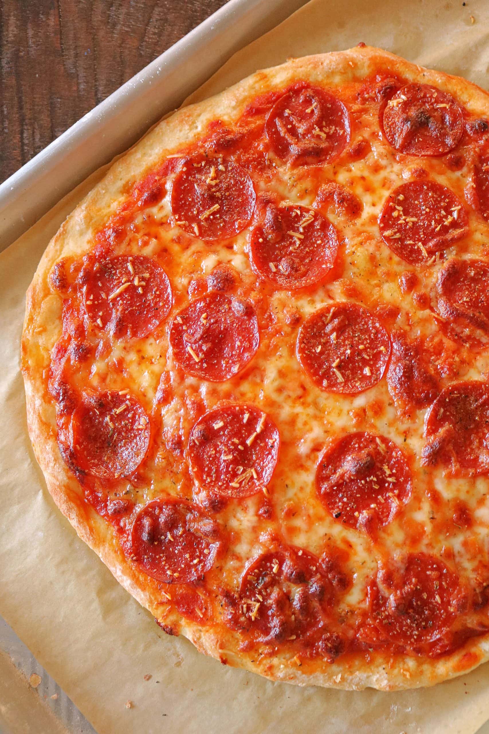 This Easy 2 Ingredient Pizza Dough with Self Rising Flour makes the most delicious pizza crust with no yeast or rising time required! Try my simple and healthy Weight Watchers Pizza Dough made with plain non-fat Greek yogurt and self-rising flour for your next homemade pizza night, and use it for pizza dough, cheese sticks, pretzel bites, and more! #pizzadough #pizza #weighwatchers #greekyogurtpizzadough #selfrisingdough