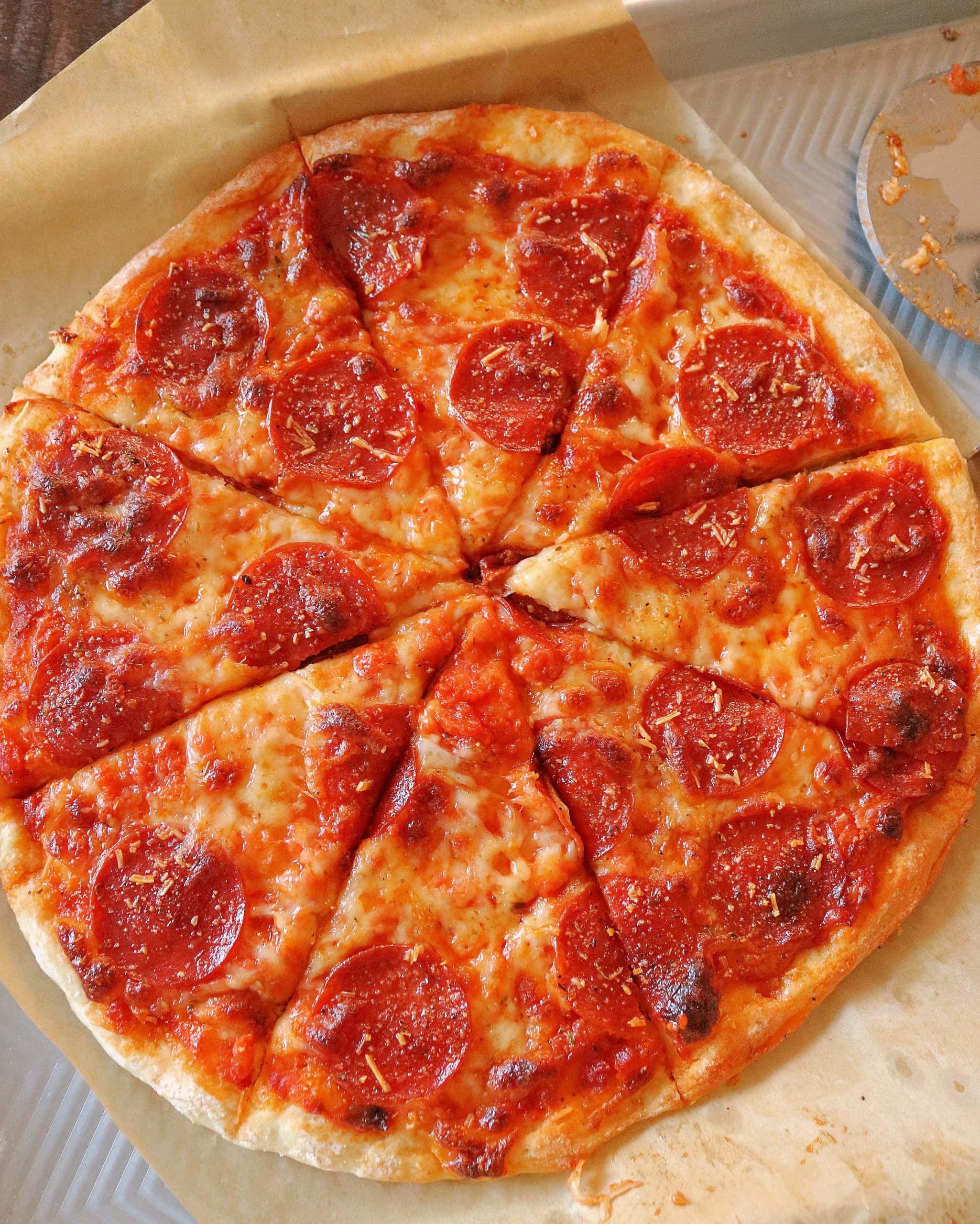This Easy 2 Ingredient Pizza Dough with Self Rising Flour makes the most delicious pizza crust with no yeast or rising time required! Try my simple and healthy Weight Watchers Pizza Dough made with plain non-fat Greek yogurt and self-rising flour for your next homemade pizza night, and use it for pizza dough, cheese sticks, pretzel bites, and more! #pizzadough #pizza #weighwatchers #greekyogurtpizzadough #selfrisingdough
