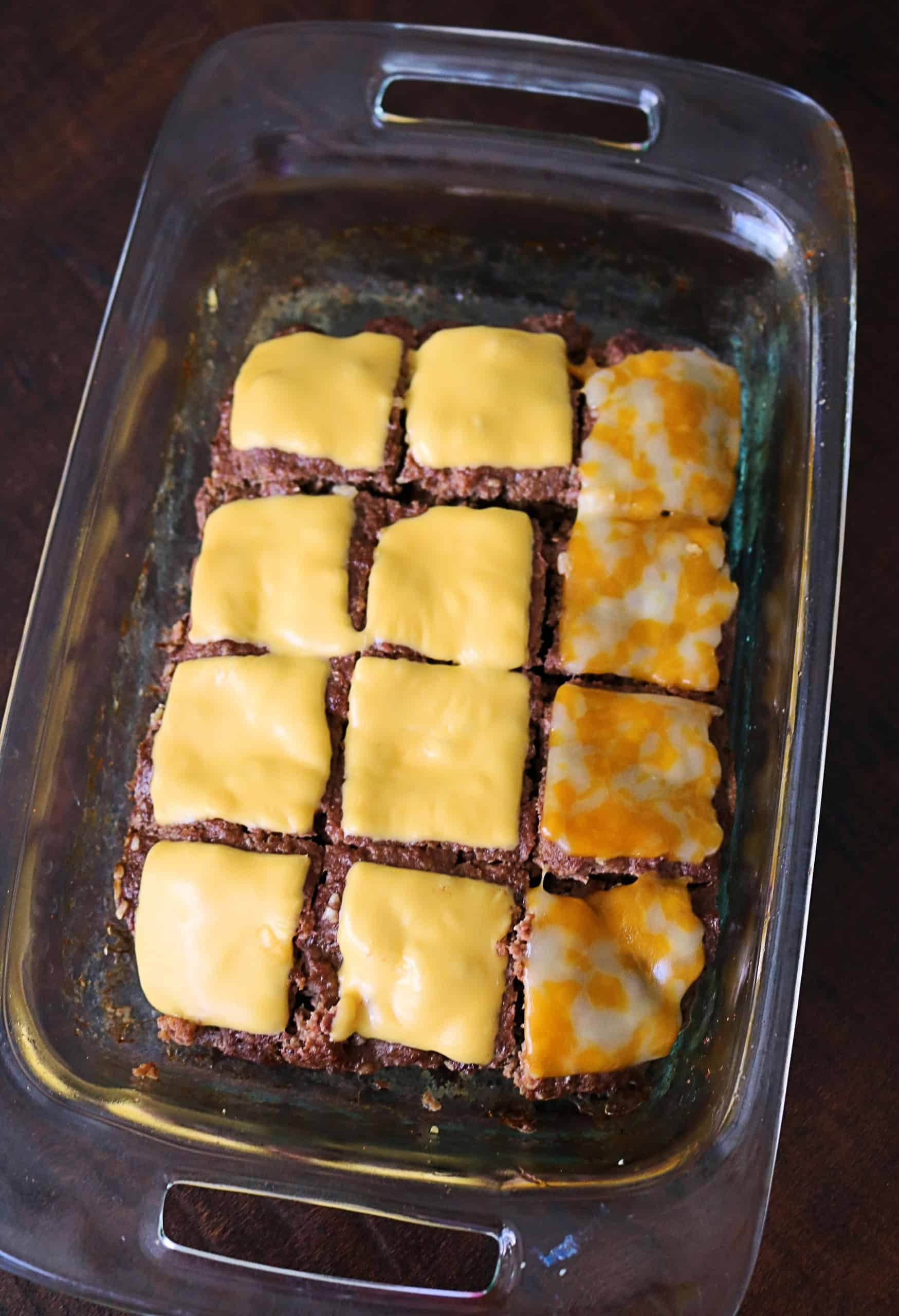 Grab some hamburger meat, dinner rolls, and cheese, and make these Delicious and Easy Cheeseburger Sliders for your next family dinner! They're juicy, flavorful, and oven baked on a sheet pan for quick and easy cheeseburgers for a crowd or party! #cheeseburgersliders #sliders #cheeseburgers #easydinner