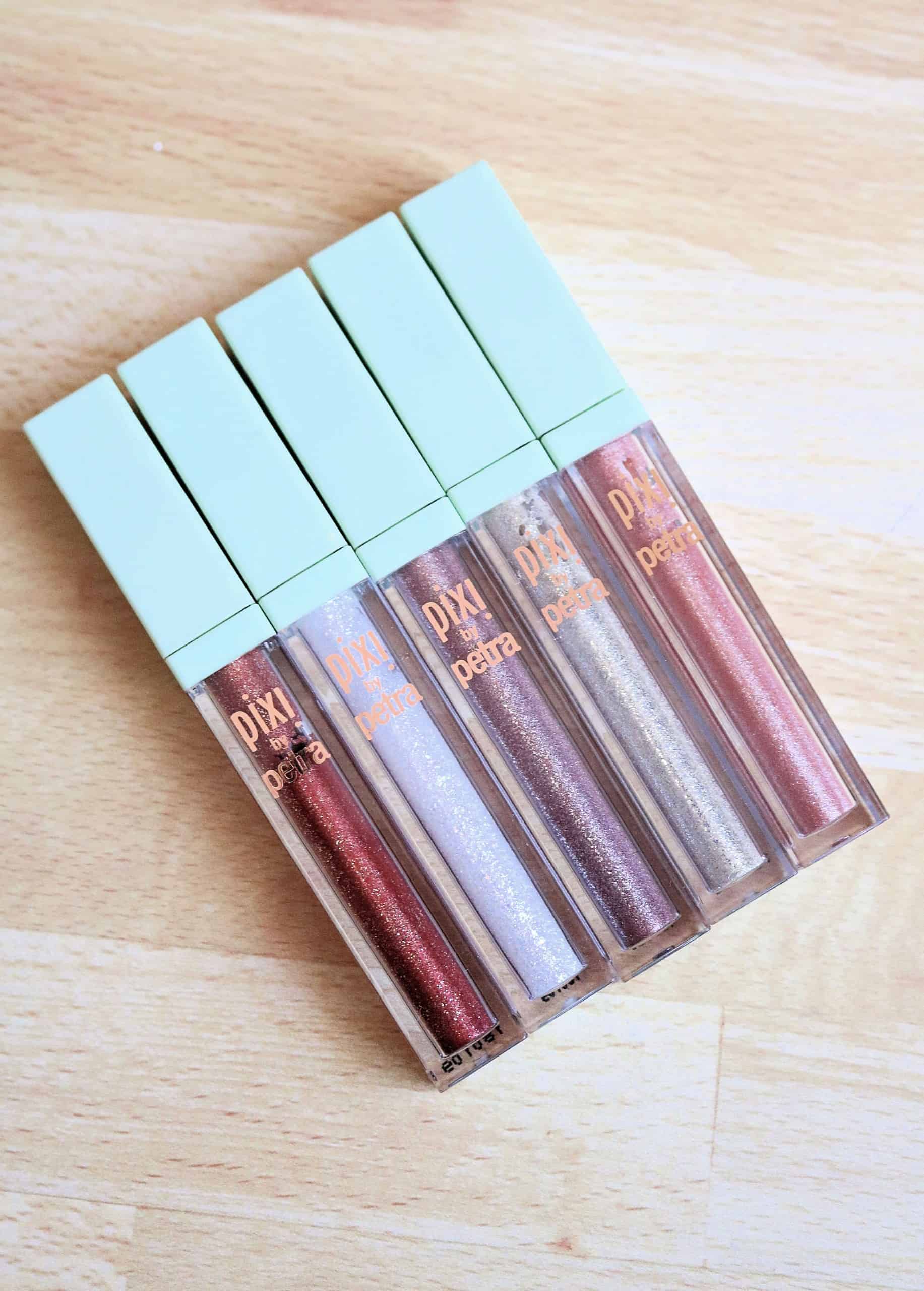 The Pixi Liquid Fairy Lights Glitter Eyeshadows are so beautiful and an affordable alternative to the Stila Glitter and Glow liquid eyeshadows. Check out my full review and swatches of all 5 glitter liquid eyeshadow shades. #pixibeauty #drugstoremakeup #makeupreview