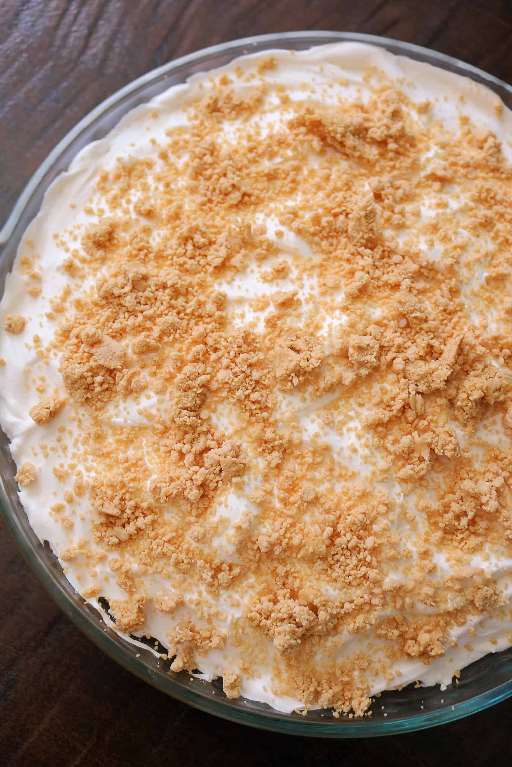 Try my Easy No Bake Peanut Butter Pudding Pie with a creamy peanut butter and vanilla pudding pie filling, whipped cream topping, homemade peanut butter crumble, & graham cracker crust. This no bake peanut butter pie dessert is so delicious! #peanutbutterpie #puddingpie #nobakepie