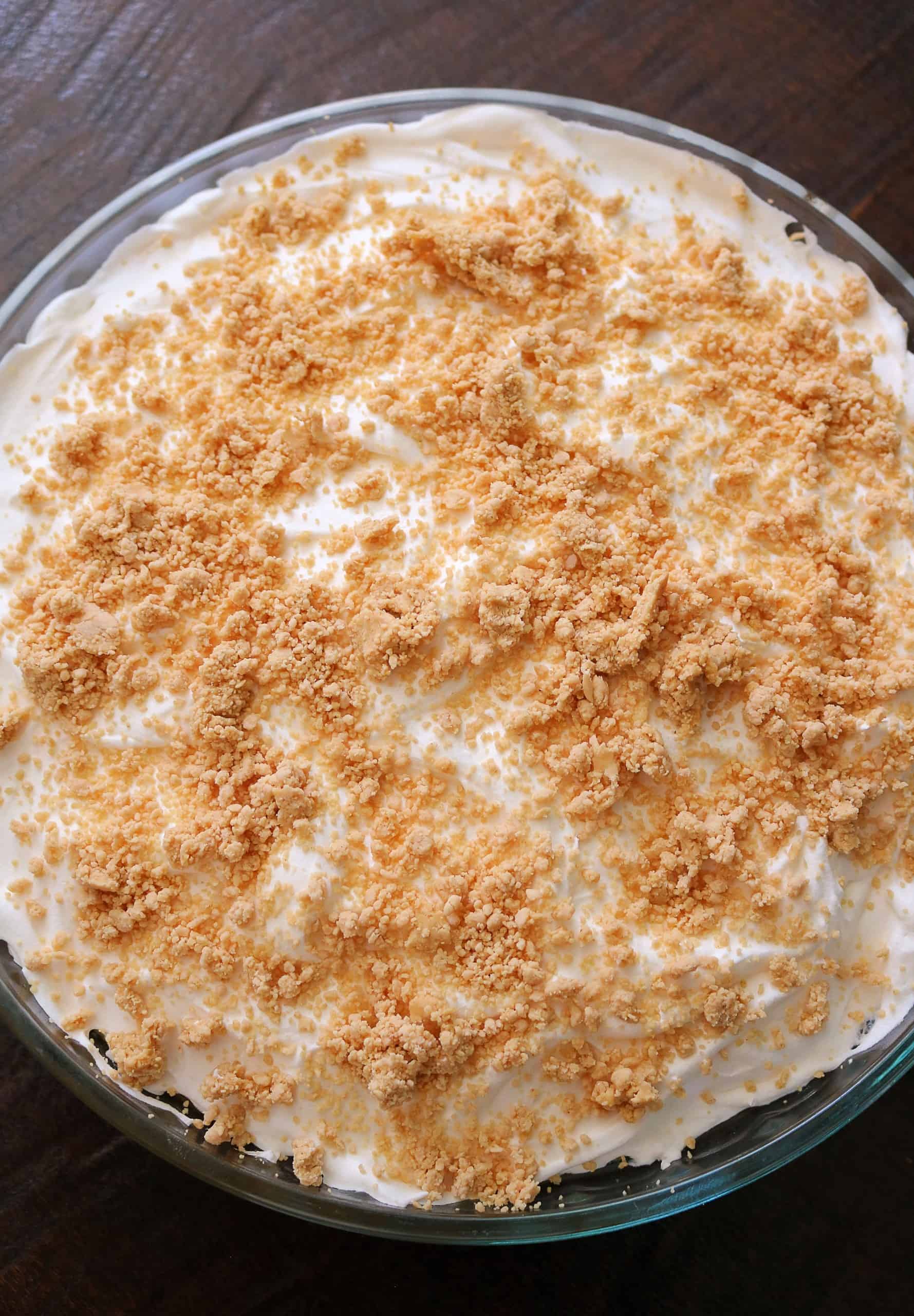 Try my Easy No Bake Peanut Butter Pudding Pie with a creamy peanut butter and vanilla pudding pie filling, whipped cream topping, homemade peanut butter crumble, & graham cracker crust. This no bake peanut butter pie dessert is so delicious! #peanutbutterpie #puddingpie #nobakepie