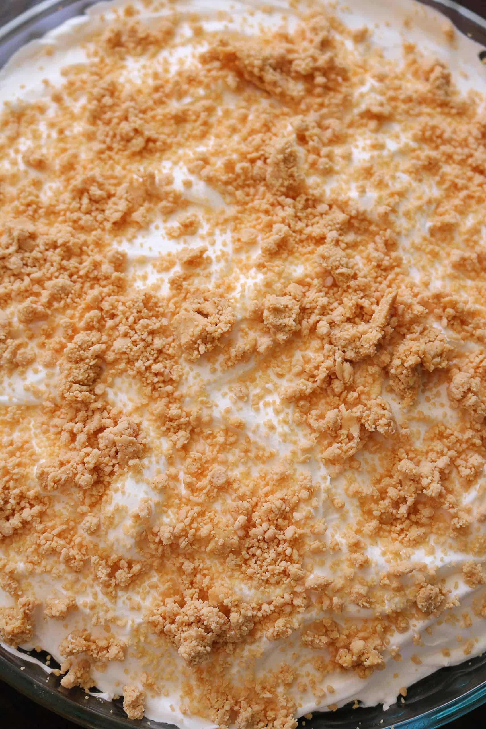 Try my Easy No Bake Peanut Butter Pudding Pie with a creamy peanut butter and vanilla pudding pie filling, whipped cream topping, homemade peanut butter crumble, & graham cracker crust. This no bake peanut butter pie dessert is so delicious! #peanutbutterpie #puddingpie #nobakepie