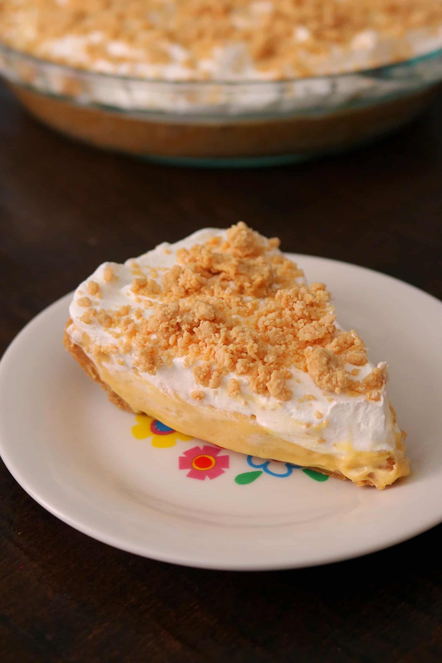 Try my Easy No Bake Peanut Butter Pudding Pie with a creamy peanut butter and vanilla pudding pie filling, whipped cream topping, homemade peanut butter crumble, & graham cracker crust. This no bake peanut butter pie dessert is so delicious! #peanutbutterpie #puddingpie #nobakepie