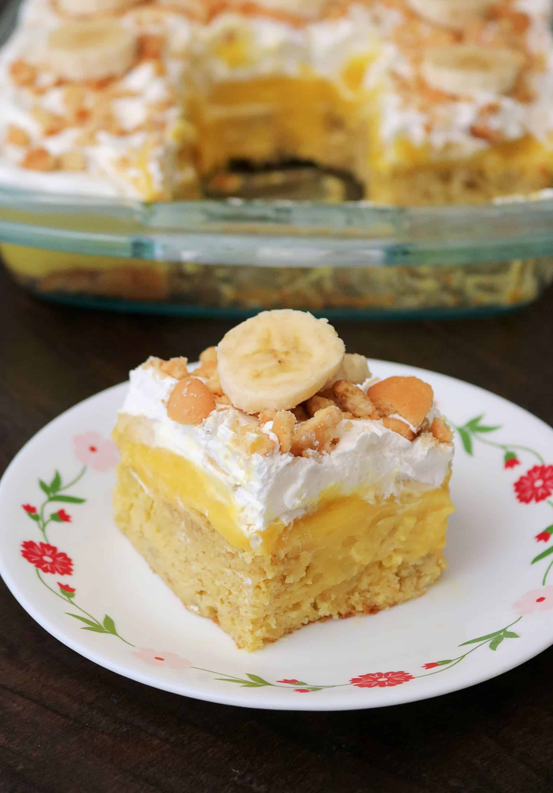 Try my Amazing Banana Pudding Poke Cake for an easy and delicious Southern twist on classic banana pudding. This banana poke cake is made with a boxed yellow cake mix, layers of vanilla pudding, whipped cream or cool whip, and a delicious homemade vanilla wafer crumb topping. Watch my video for an easy step-by-step guide. #bananapudding #pokecake #bananacake #easycake